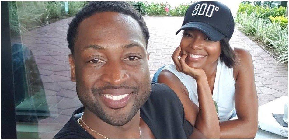 Dwyane wade gabrielle union snuggle up together.
