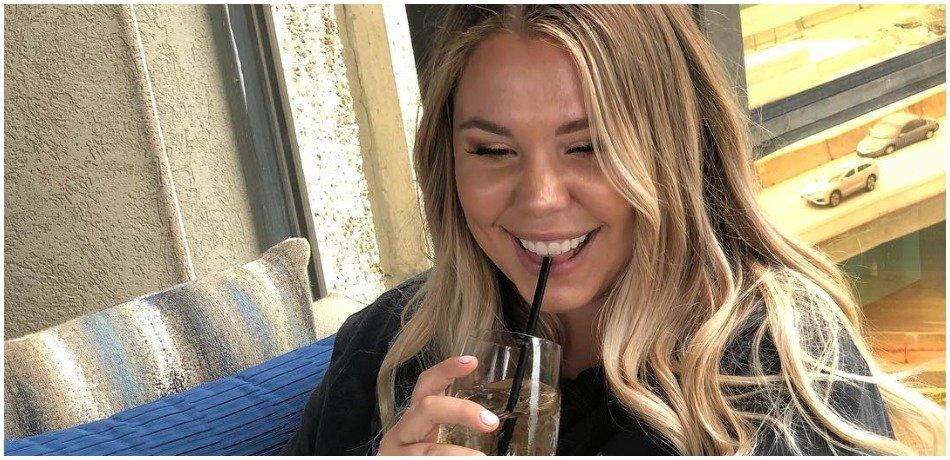 Kailyn Lowry looks at her phone in this social media photo.