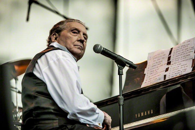 Jerry Lee Lewis plays the piano.