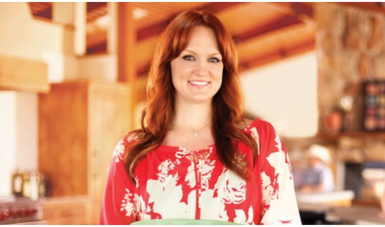The Pioneer Woman Ree Drummond poses in her kitchen.