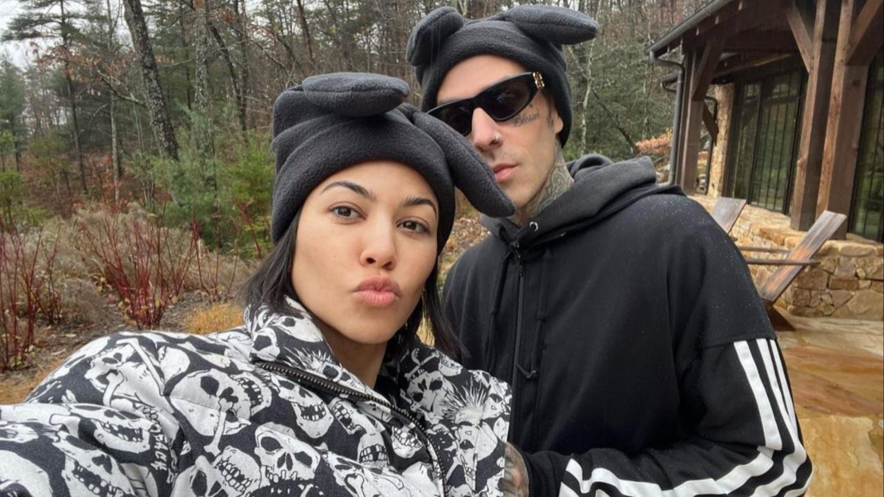 Kourtney Kardashian and Travis Barker posing.
