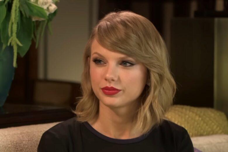 Taylor Swift wearing red lipstick.